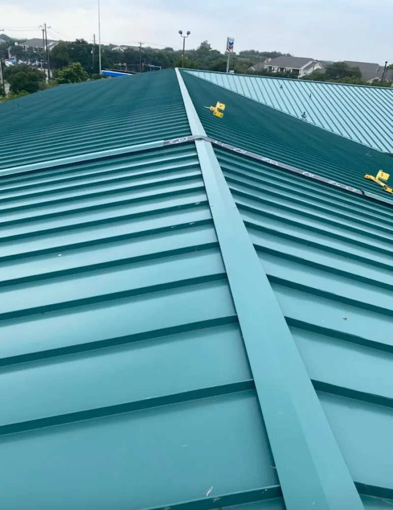 Green commercial metal roof ridge and valley for Metal Roof Repair in Edinboro